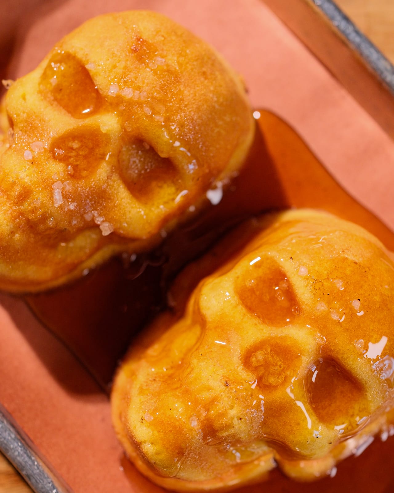 Skull-shaped house cornbread glazed with salted honey at Apocalypse BBQ Kendall, Miami